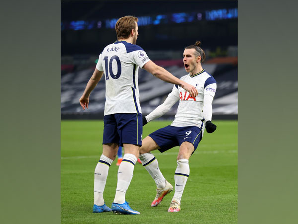 Harry Kane and Gareth Bale celebrating after scoring a goal.