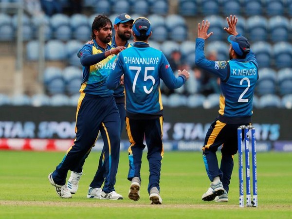Nuwan Pradeep celebrates after taking a wicket