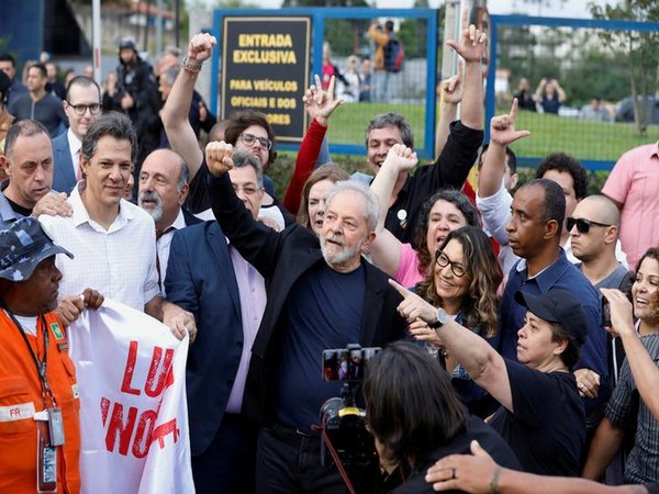 Former Brazilian President Lula da Silva gestures after being released from prison, in Curitiba on Friday