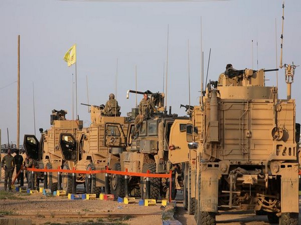 American soldiers stand near military trucks, at al-Omar oil field in Deir Al Zor, Syria back in the month of March (File Photo) 
