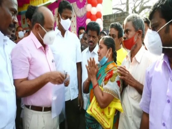 Tamil Nadu woman begging the Trichy District Collector for help. (Photo/ANI)
