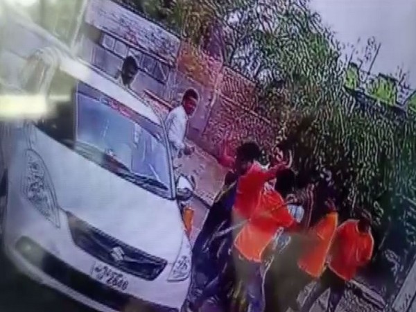 The CCTV camera footage showing toll plaza employees beating up car passengers with sticks. Photo/ANI