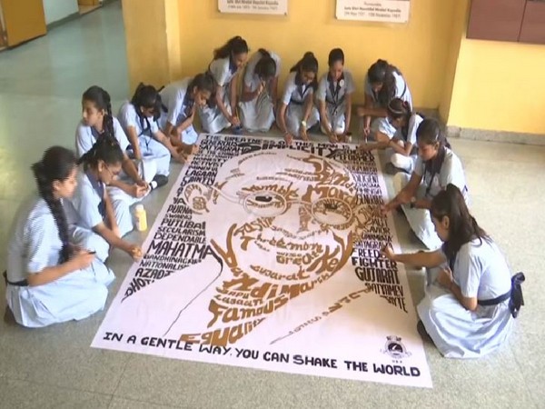 Students making Gandhi's picture with 150 words. (Photo/ANI)
