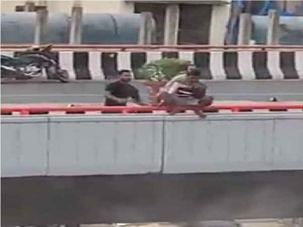 Locals rescue mentally challenged man trying to jump off flyover in Rajendranagar area on Thursday. (Photo/ANI)