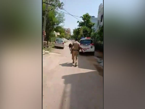 Police personnel rushing the woman to the patrol van. Photo/ANI