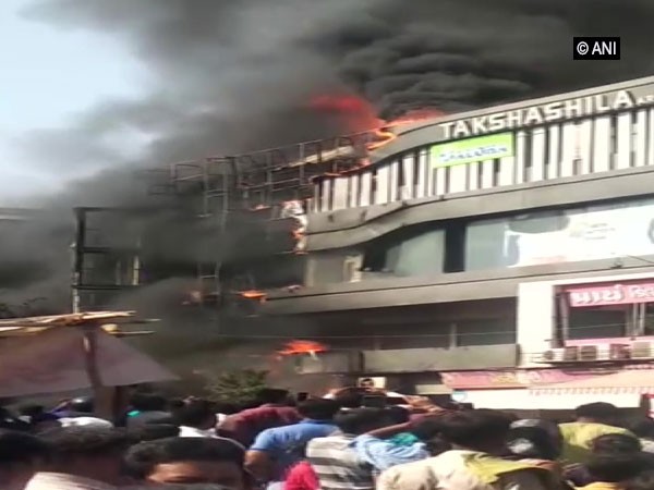 Visuals of the fire that broke out in Surat on Friday. Photo/ANI