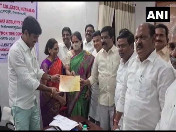 TRS candidate K Kavitha receives her certificate from Returning Officer after being unanimously re-elected as MLC of local bodies of Nizamabad and Kamareddy districts. (Photo/ANI)