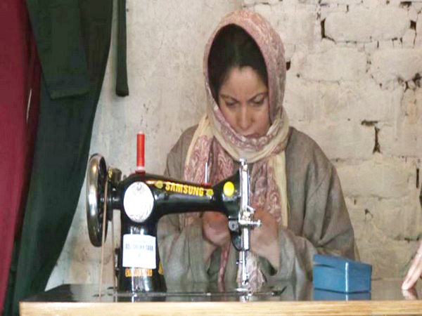 A Kashmiri woman being trained in stitching (Photo/ANI)