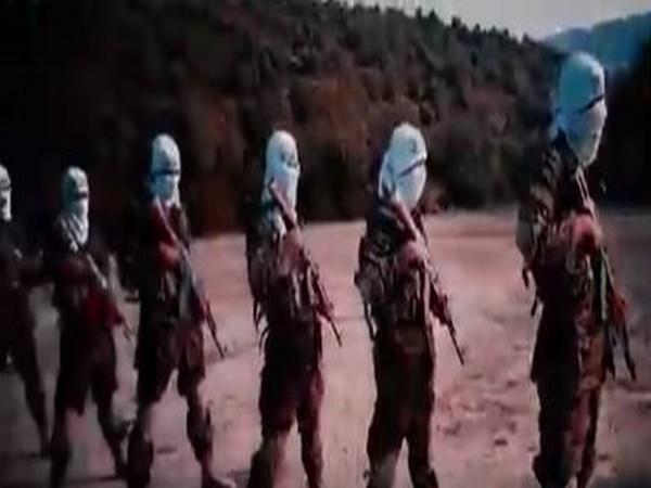 A still from the recent Taliban video (posted by twitter user Bill Roggio) showing the unit training in broad daylight. 