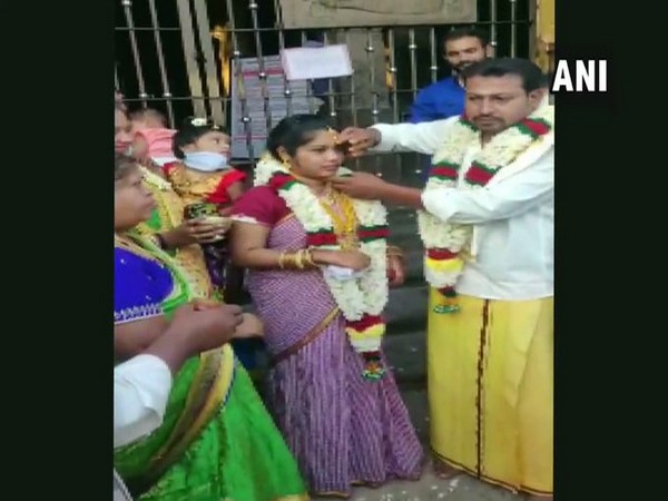 Wedding rituals of the couple performed outside the temple in Madurai, Tamil Nadu