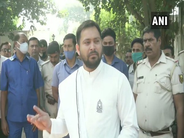 RJD leader Tejashwi Yadav speaking to reporters in Patna, Bihar.