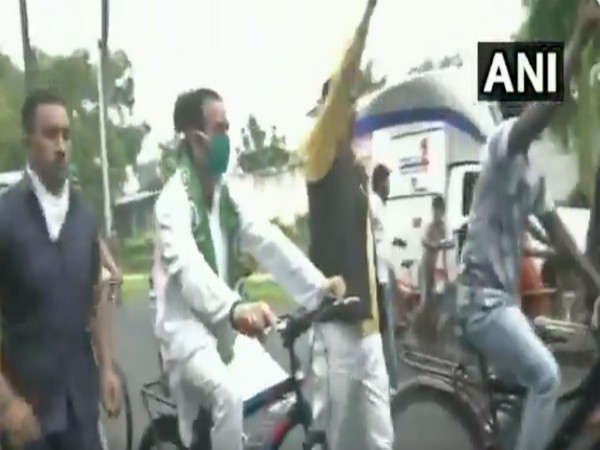 Tej Pratap Yadav riding a cycle during the protest against hike in fuel prices. [Photo/ANI]