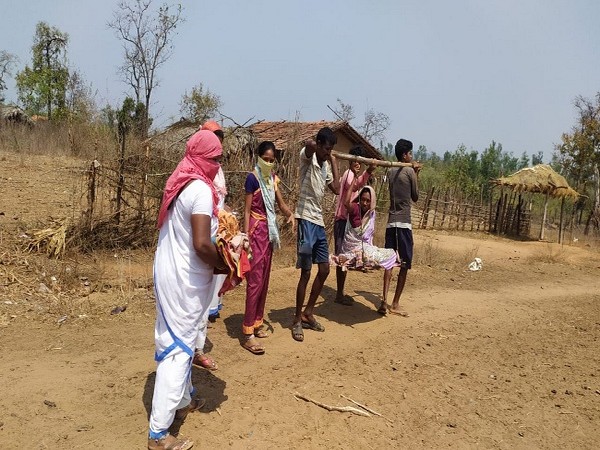 The woman and her new born baby being carried to nearby PHC for further treatment in Telangana. 