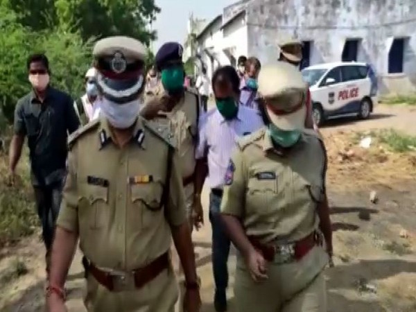 Telangana Police inspecting the site where four members of a family were found dead in a well. Photo/ANI