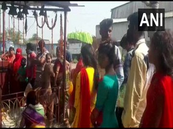 People were seen without masks at the temple in Durgapur.