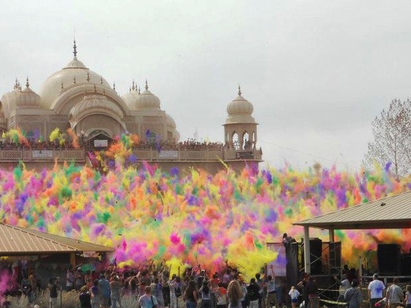 Colours been blown to the air at Dwarkadhish Temple on the occassion of Holi (File photo/ANI)
