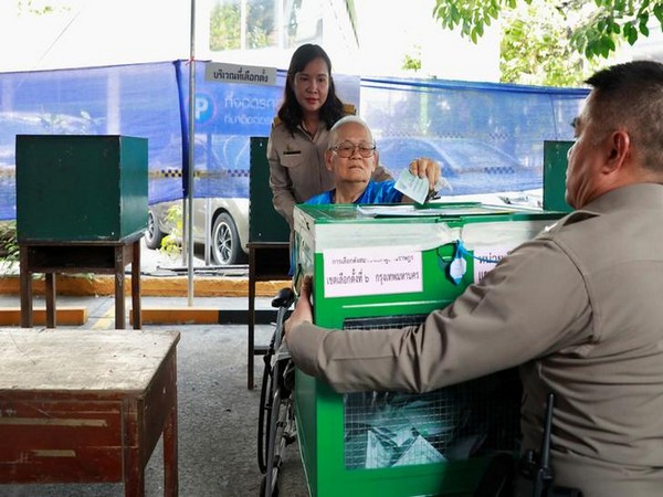 A voter casts ballot at a polling station in Bangkok, Thailand