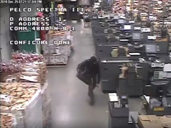 The Auburn police department recently released CCTV footage of the bogeyman on Facebook, who can be seen walking past a line of cash counters (Picture Courtesy: Facebook)