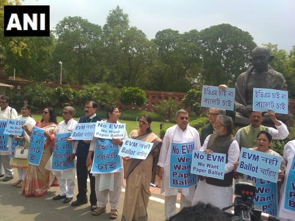 TMC MPs in front of Mahatma Gandhi statue at Parliament on Monday. Photo/ANI