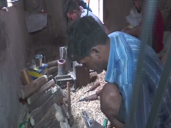 A worker making wood toy at a factory in Varanasi, Uttar Pradesh.