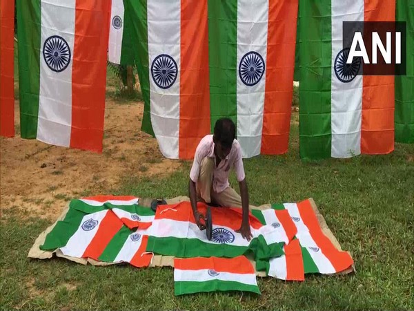 A visual of flagmaker printing the Indian flag in Agartala. (Photo/ANI)