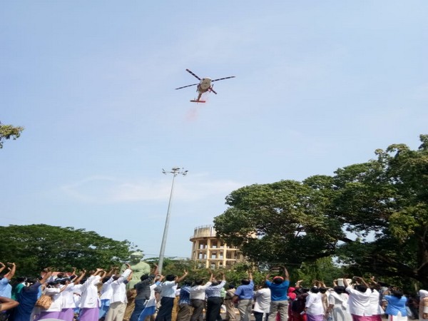 The helicopter flying over the city of Thiruvananthapuram on Sunday. Photo/ANI