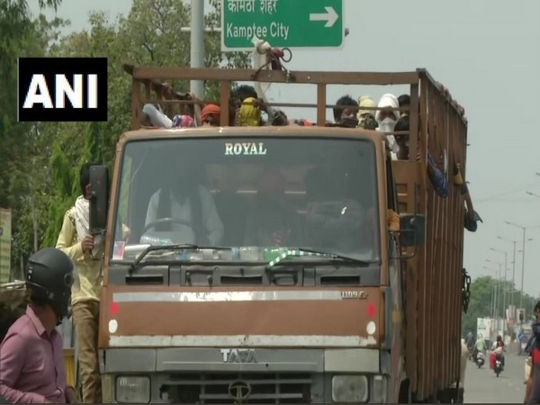 migrant workers heading from Nagpur to their native villages in truck. Photo/ANI