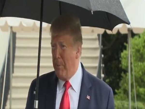 US President Donald Trump addressing reporters outside White House