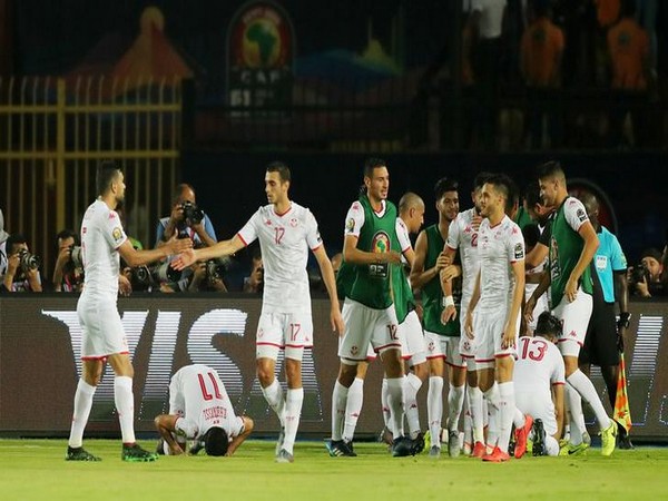 Tunisia players celebrating after scoring against Madagascar in the quarter-final match.