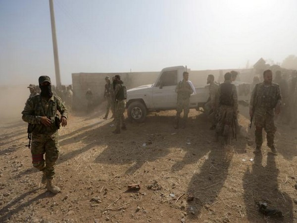 Turkey-backed Syrian rebel fighters in the village of Yabisa, near the Turkish-Syrian border.