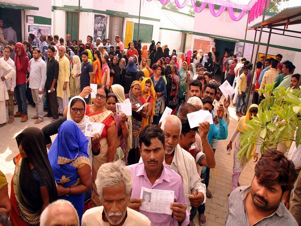 People standing in a queue to cast their vote in Sultanpur, Uttar Pradesh, during 6th phase of polling on Sunday. Photo/ANI