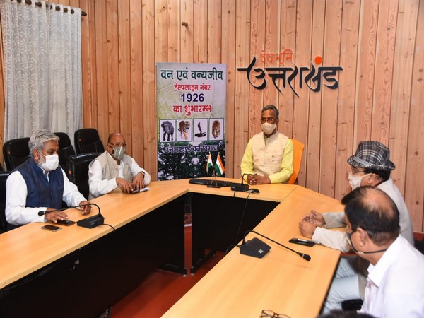Uttarakhand Chief Minister Trivendra Singh Rawat with officials during forest and wildlife helpline launch event on Thursday. (Photo/ANI)