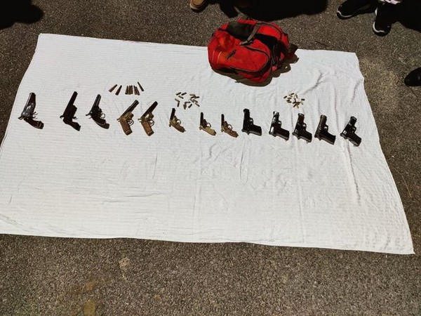 The accused was found carrying a backpack containing 13 sophisticated pistols and 38 live cartridges. (Photo/ANI)