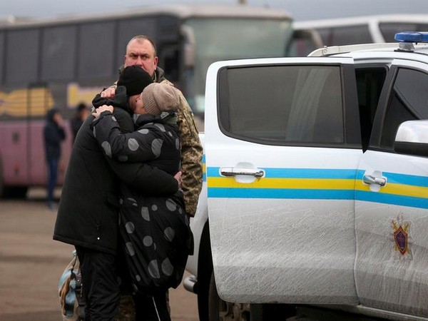 A Ukrainian citizen embraces a relative after he was released as part of a prisoner swap deal on Sunday.