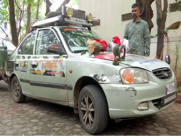 Umesh Jadhav, an artist with his specially designed car in Maharashtra. Photo/ANI
