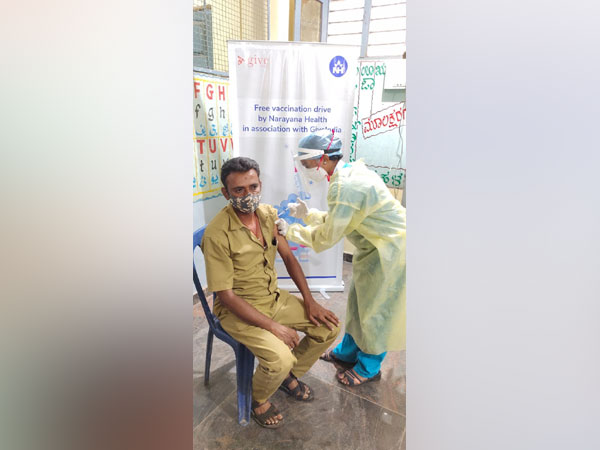 Beneficiary getting inoculated at the Free COVID-19 vaccination drive organised by Narayana Health and GiveIndia