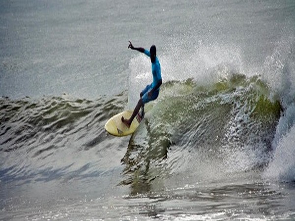 Sekar, Indian surfer from Chennai while surfing during the Covelong Surfing National Championship 2019.