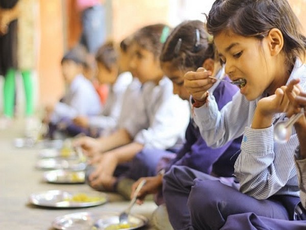 Girl Child enjoying her mid-day meal