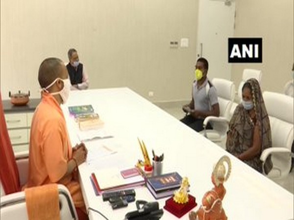 Family members of sub-inspector Nebulal meeting UP CM Yogi Adityanath on Sunday. Photo/ANI.