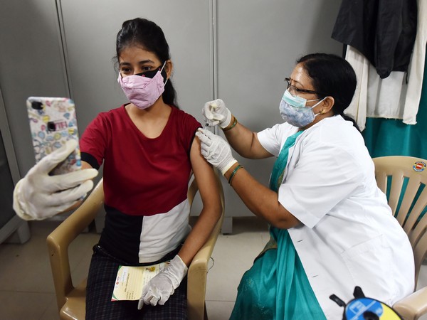 Visuals of COVID-19 vaccine being administered to a beneficiary at Moti Lal Nehru Medical College in Uttar Pradesh's Prayagraj on May 20. (ANI Photo)