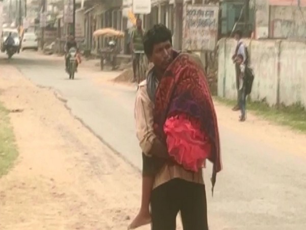 Visuals of man carrying his 7-year-old daughter's body on his shoulders