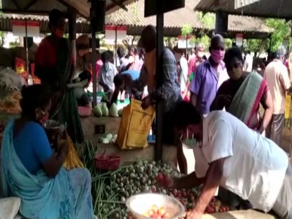 People buying vegetables at BB Kulam Uzhavar Santhai Market on Thursday.       Photo/ANI