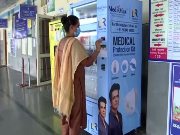 A customer using the vending machine to purchase a sanitiser  at the Chandigarh Railway Station (Photo/ANI)