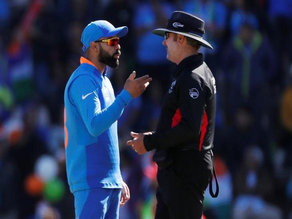 Indian skipper Virat Kohli in conversation with ground umpire during the match against Afghanistan