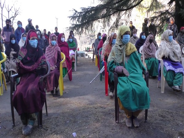 People waiting to receive their COVID-19 kits from the Police. (Photo/ANI)