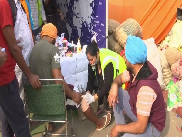 Medical staff dressing injuries of a farmer at the Singhu border. (Photo/ANI)