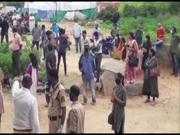 Parents gather outside St Andrews School in Telangana's Bowenpally to protest against school fees charged by the management. (Photo/ANI) 