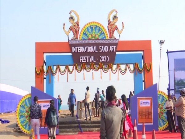 Visitors at the entrance of the International Sand Art Festival at Puri's Chandrabhaga Beach. (Photo/ANI)