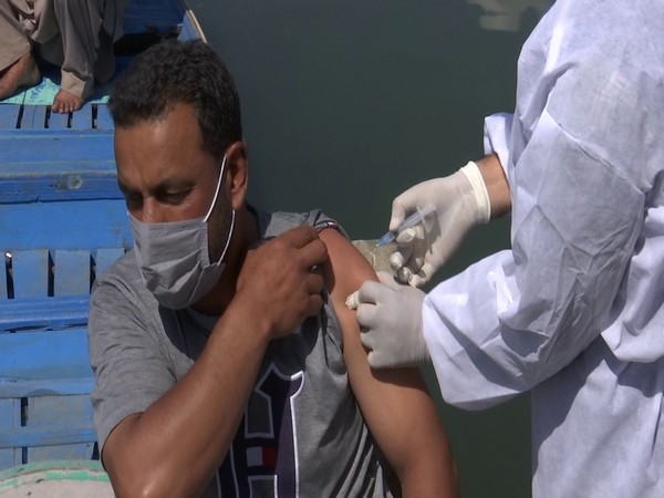 A man gets vaccinated at an innoculation centre near Dal Lake. (Photo/ANI)