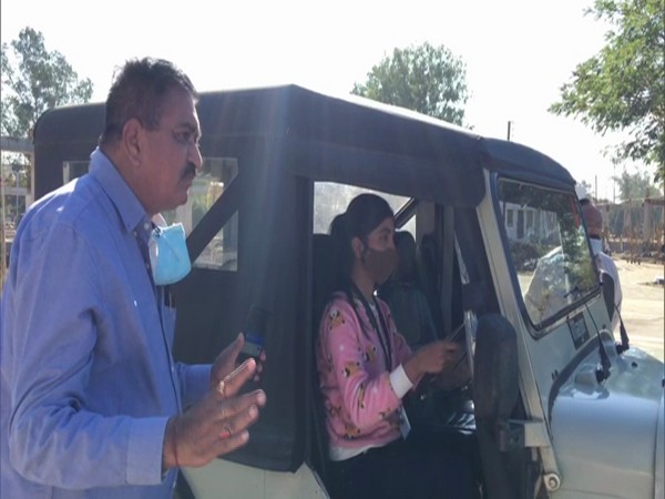 An officer guiding a women participant at Driving Training Institute in Indore. (Photo/ANI)